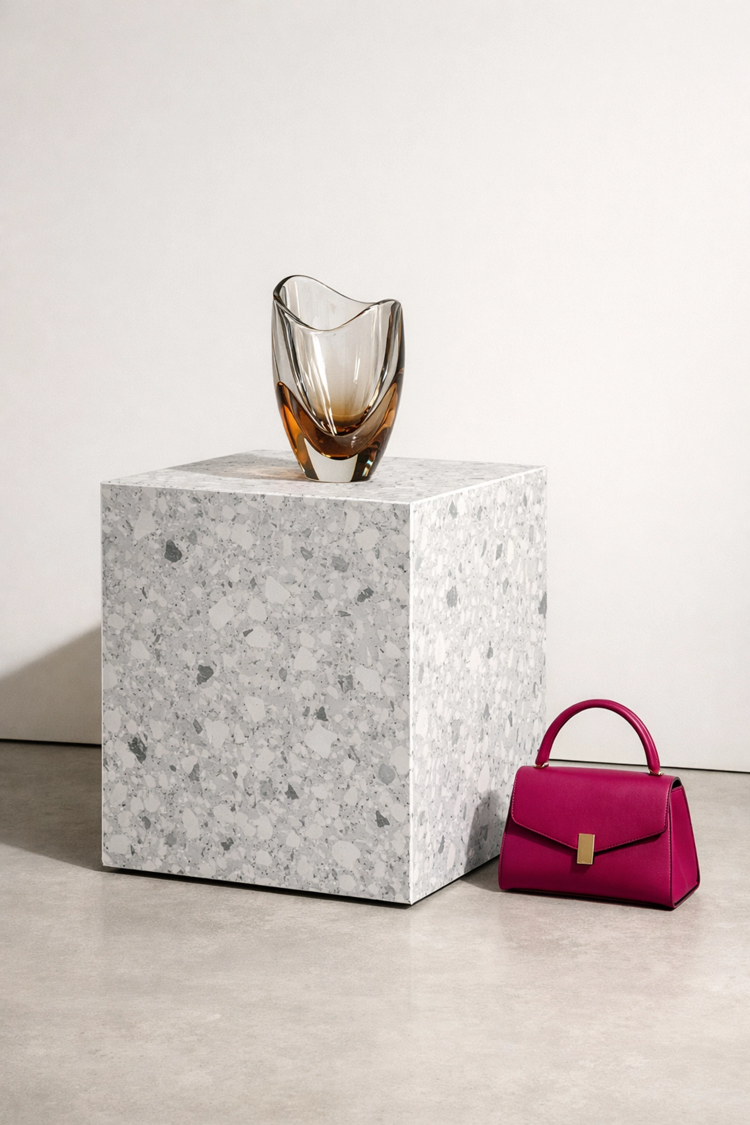 Retail display plinth made from waterproof, mottled grey recycled plastic for sustainable shopfitting.