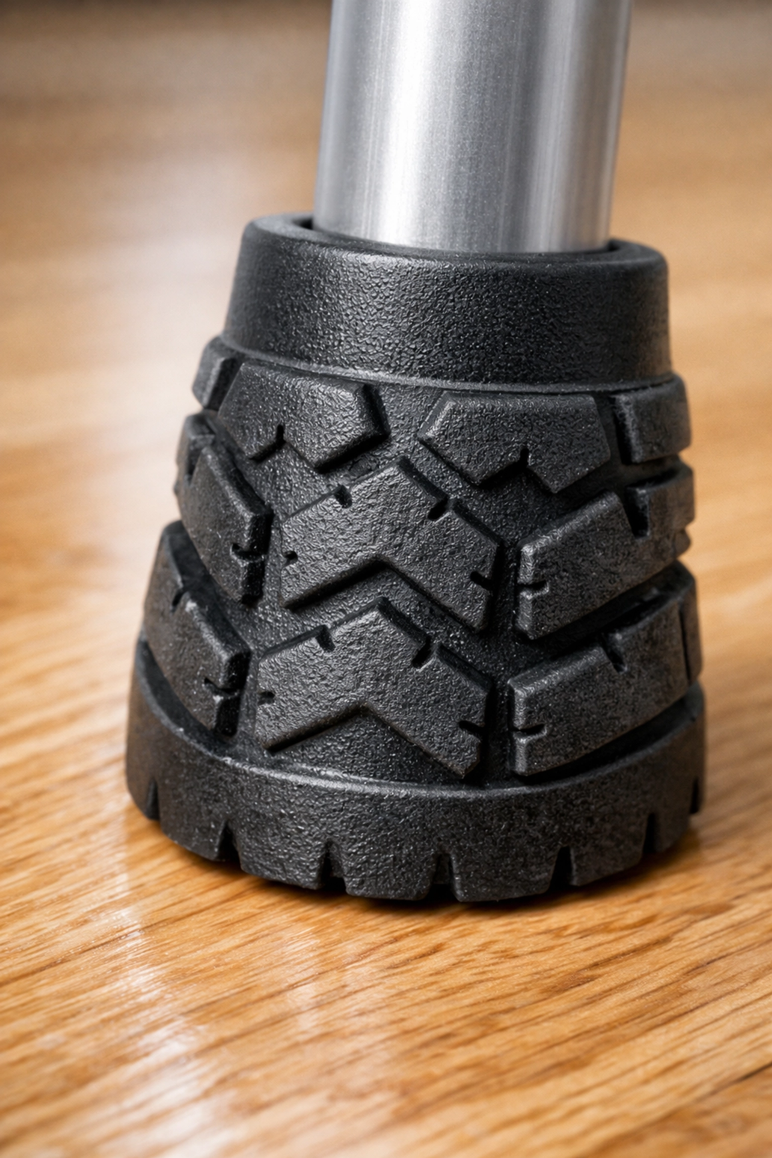 Close-up of a new non-slip rubber walker tip demonstrating safety treads for fall prevention.