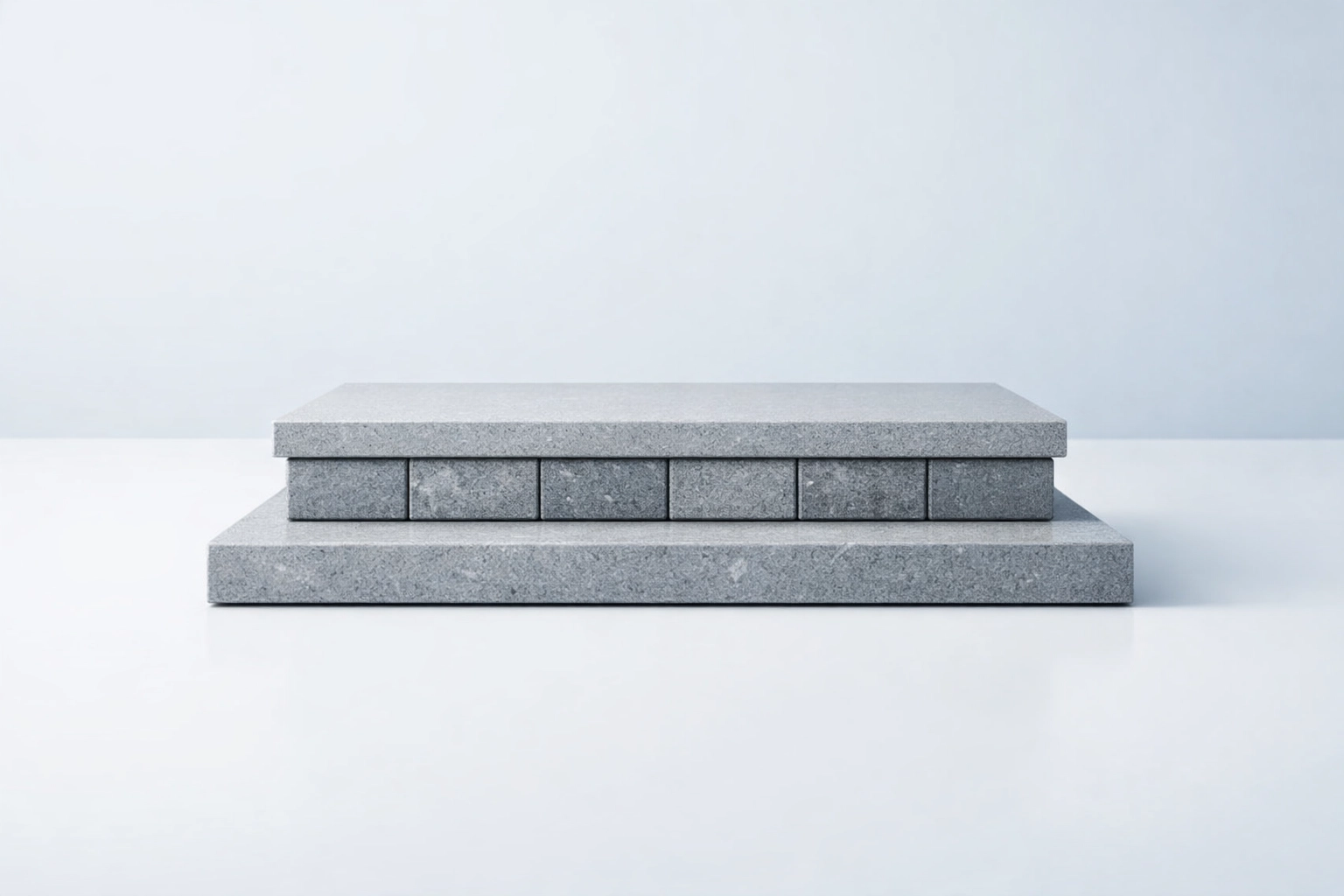 A polished stone architectural foundation symbolizing a strong foundation-first chiropractic marketing strategy.