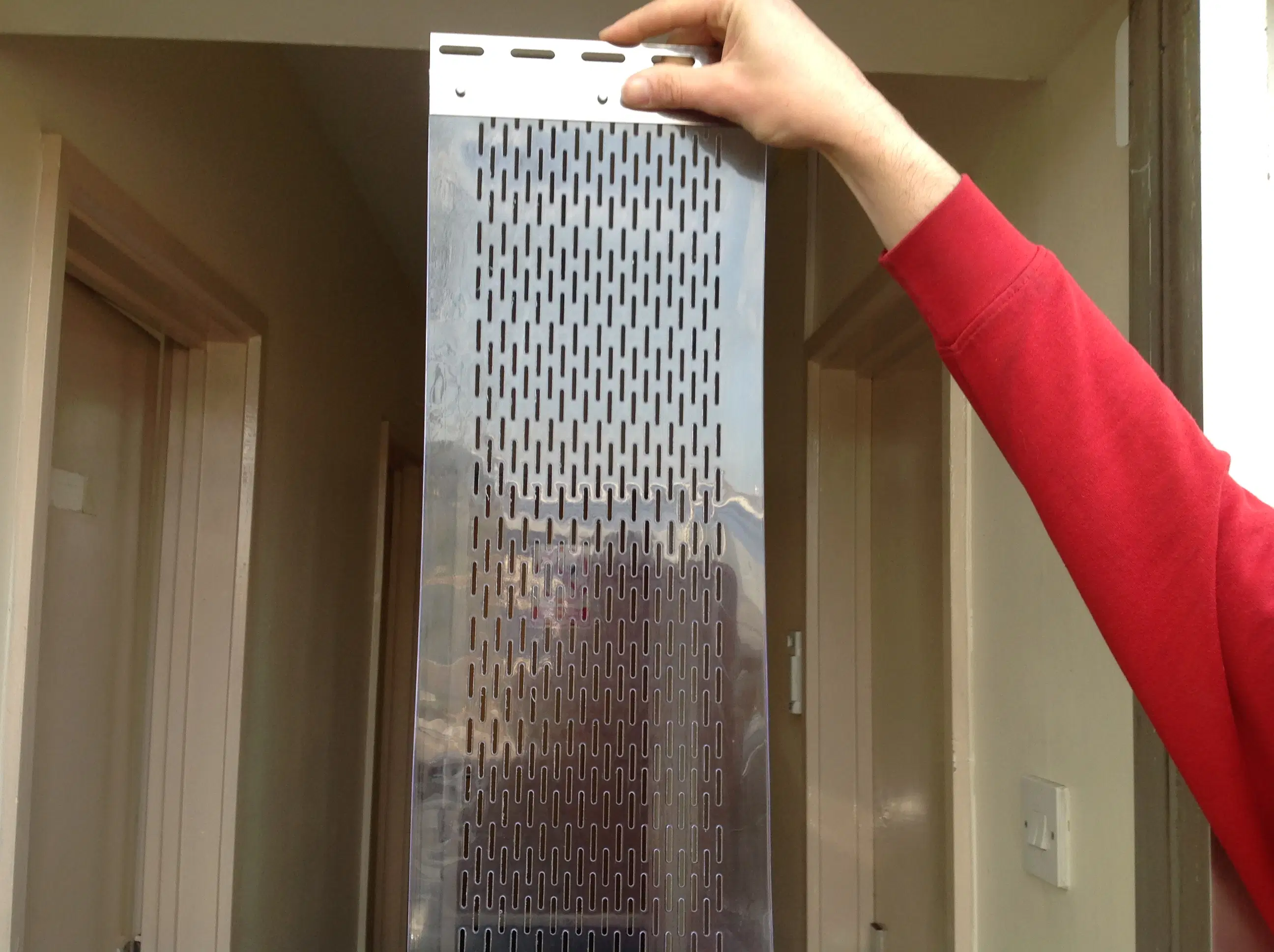 Perforated PVC strip detail showing punched ventilation holes