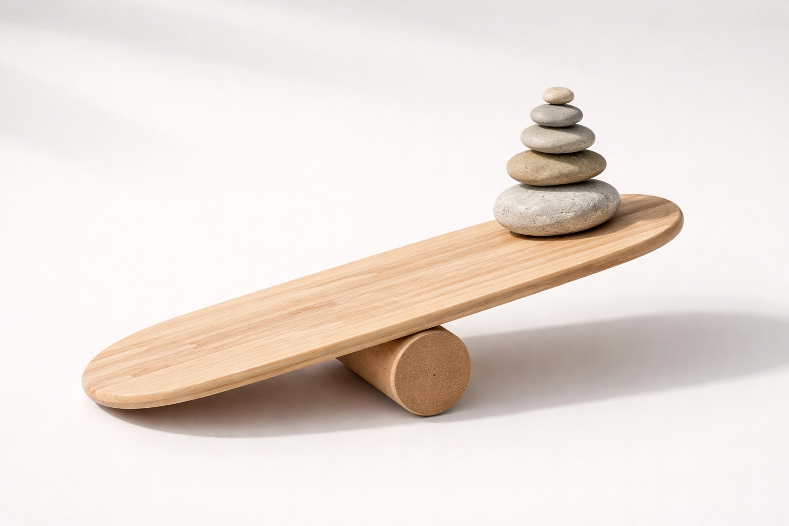 Balance board with stones symbolizing body imbalance, a root cause of sciatica pain and misdiagnosis