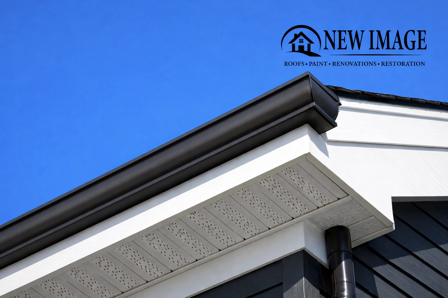 Detailed view of newly repaired white fascia and soffit on an Atlanta home protecting against Georgia elements.