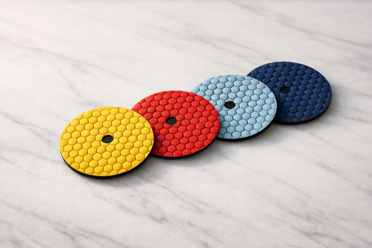 Professional diamond polishing pads used for natural stone restoration and marble resurfacing.