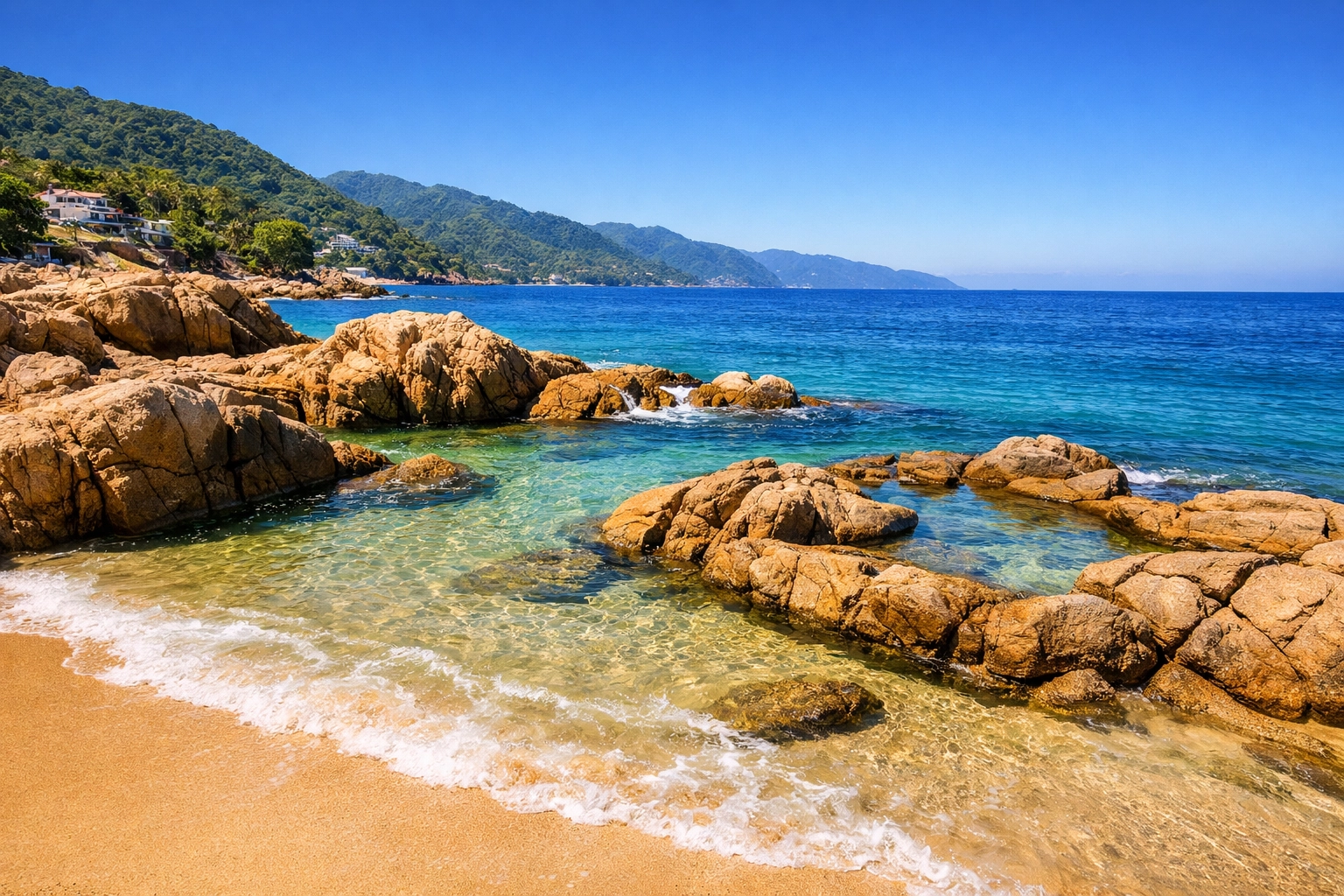 Conchas Chinas Beach in Puerto Vallarta with clear turquoise water and rock formations near local condo rentals.