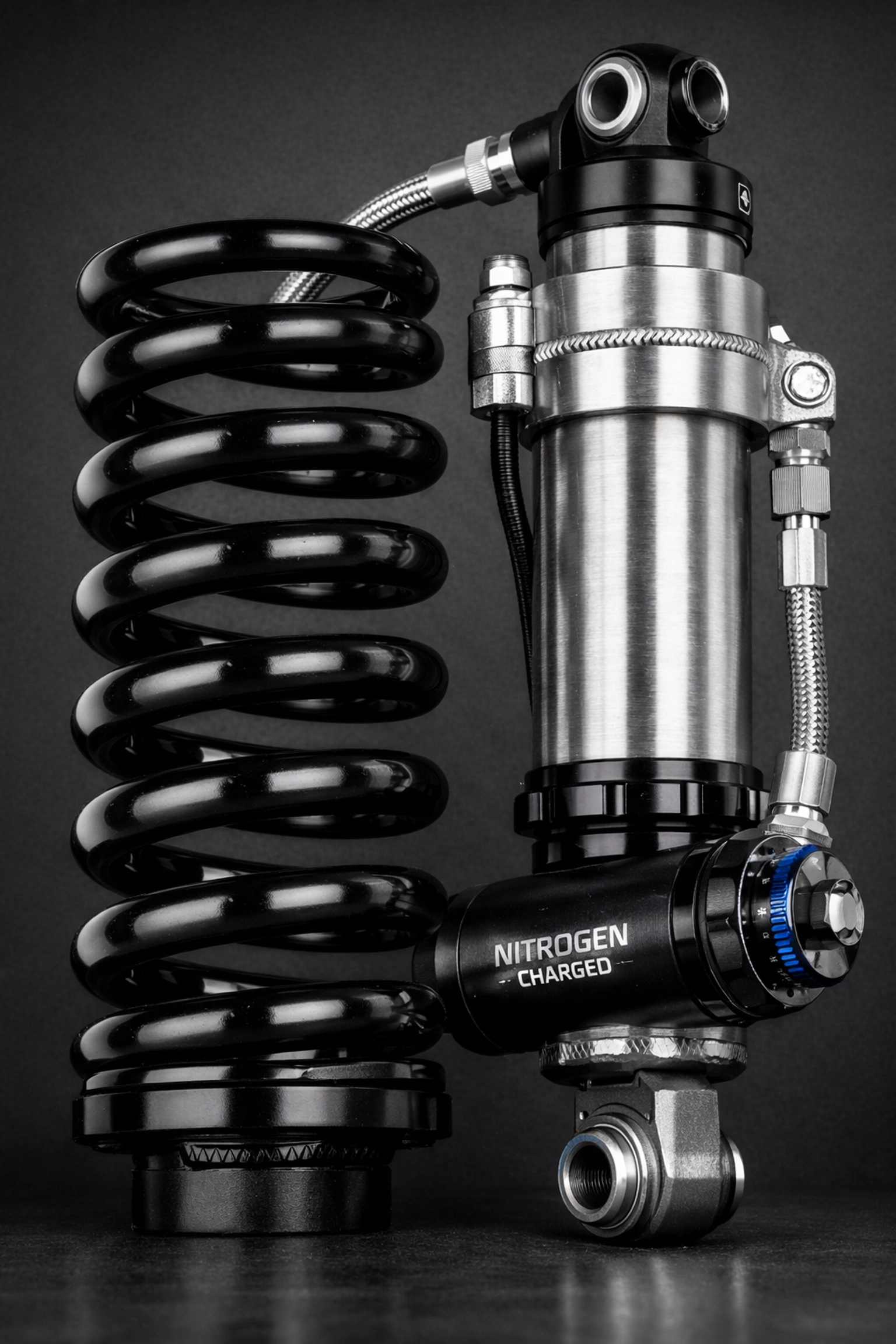High-performance reservoir shock and coil spring for an Early Bronco suspension lift kit.
